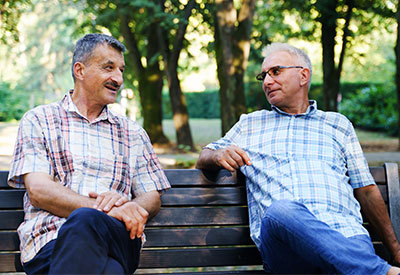 two men on a park bench