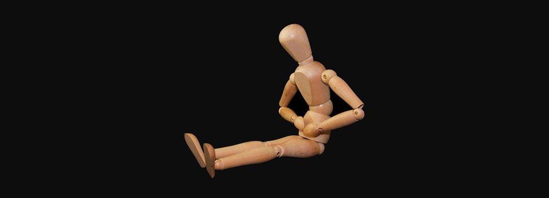 a toy figure holding its stomach