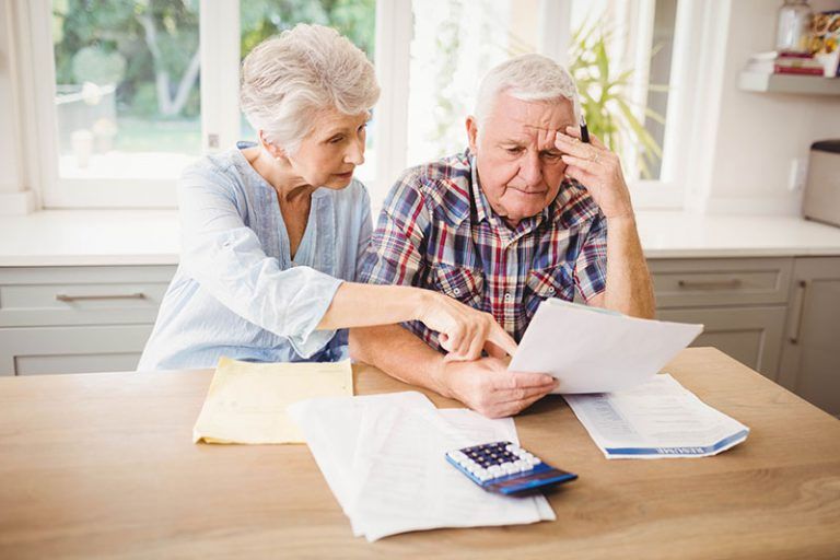 an older couple looking stressed about their estate planning mistakes