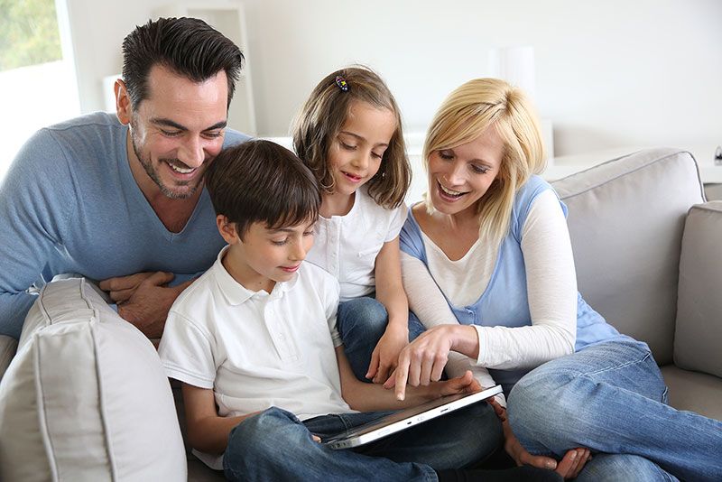 Young family watching a tablet together