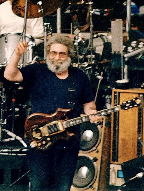 Jerry Garcia playing guitar on stage