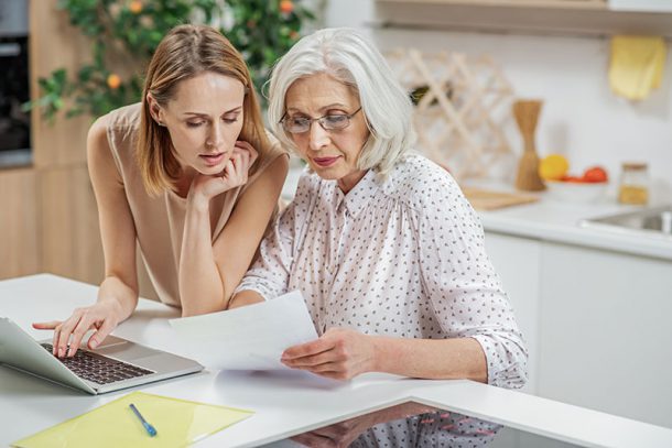 a senior mother with her daughter discussing her estate plan and trustees