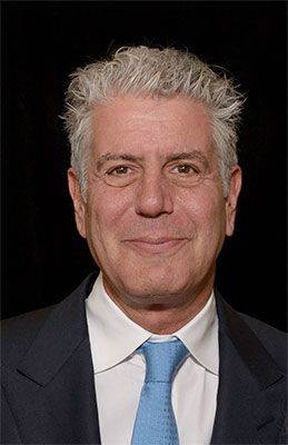 Anthony Bourdain smiling posing for a picture