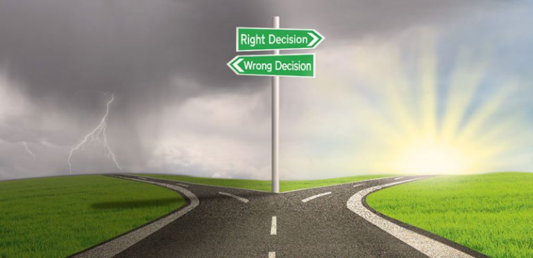 a split road a signs that says right decision and wrong decision respectively signifying making the right decision for estate planning