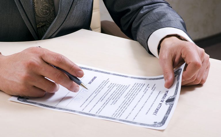 Signing a Power of Attorney document
