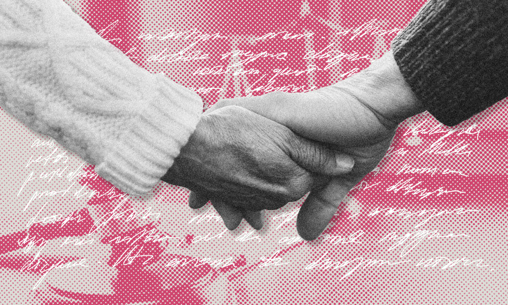 Close-up of two people holding hands, symbolizing unity in blended families. One wears a cable-knit sweater, the other a dark, textured one.