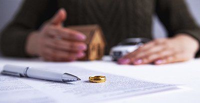 Estate Plan - Close up photo of a document, a pen, and a ring