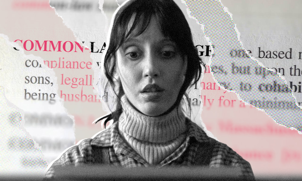 A black and white image of a woman resembling Shelley Duvall in a turtleneck sweater, gazing at a screen.