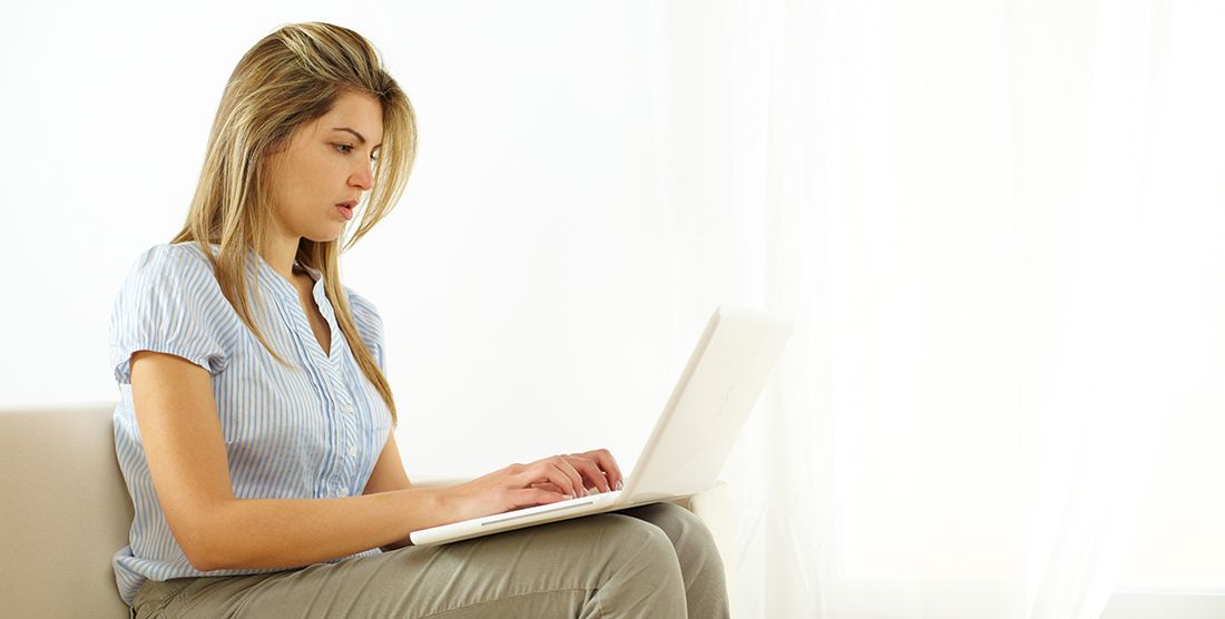 a young woman working on her estate plan on a laptop