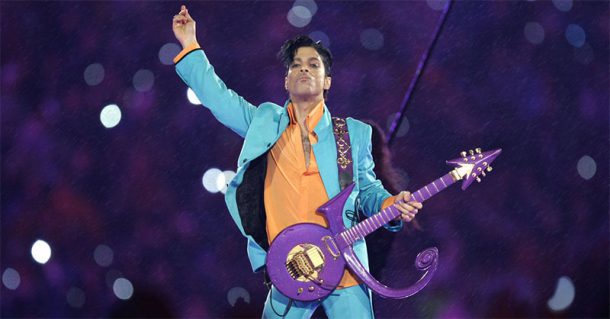 Prince playing guitar during a concert