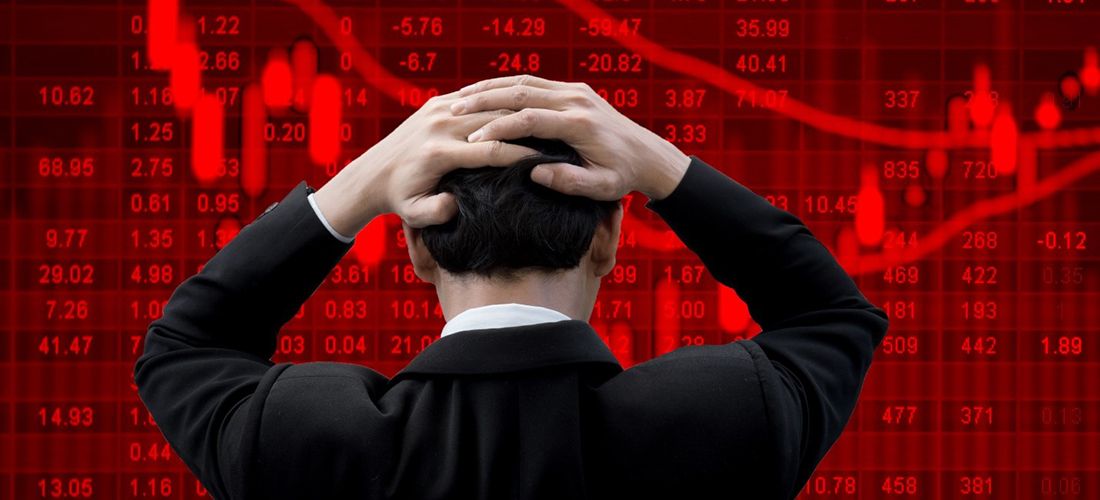 man stressed over markets being in the red