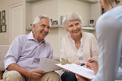 a senior couple working with an attorney on their estate plan