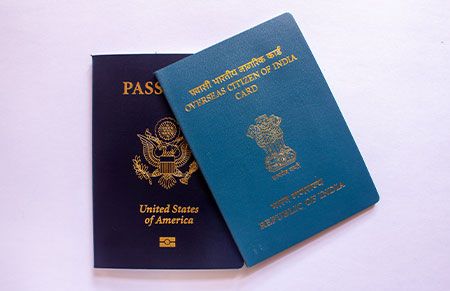 a couple of passports stacked ontop of each other
