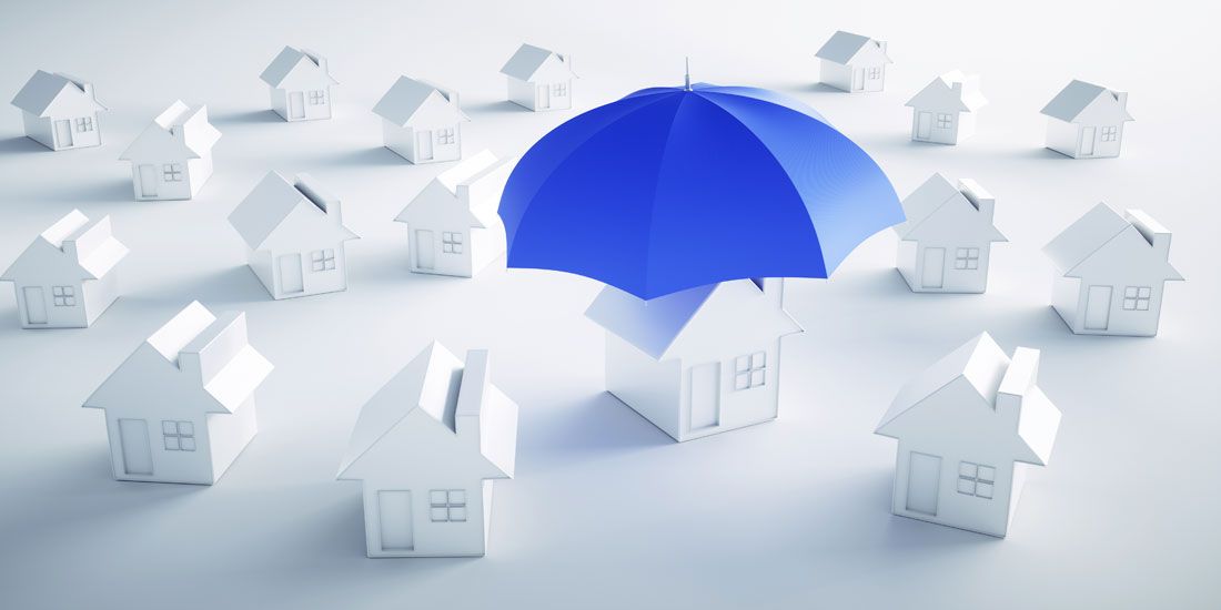 a blue umbrella covering a house