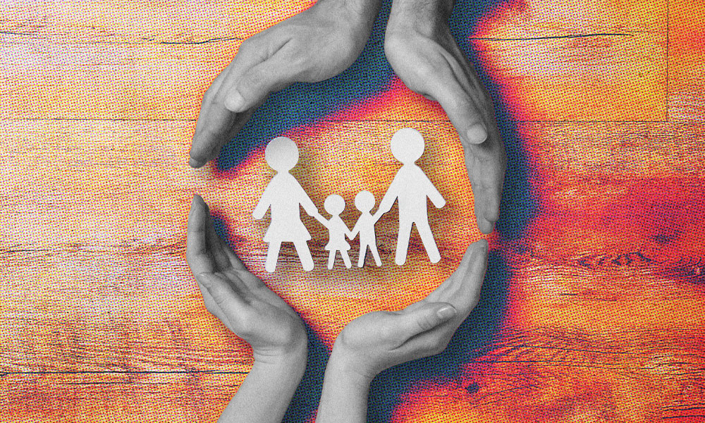 Four hands form a protective circle around paper cutouts of a family of three, symbolizing the security that life insurance brings