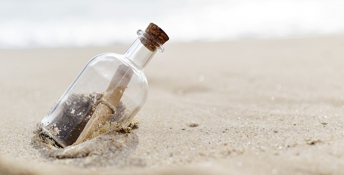 a trust document in a message in a bottle on the beach