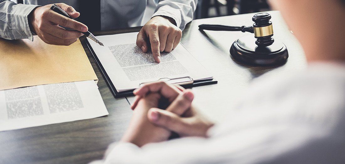 an attorney going over paperwork with a personal representative