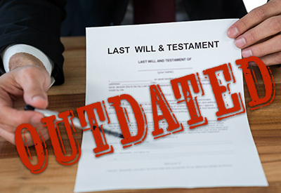 attorney presenting a last will and testament labeled outdated