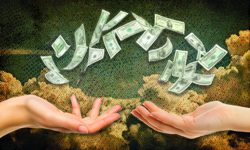 Two hands exchanging floating dollar bills, symbolizing the balance between equal and equitable inheritance in estate planning.