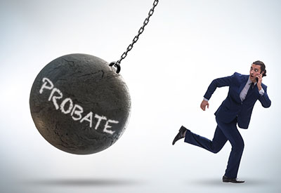 A businessman running away from a large wrecking ball labeled Probate