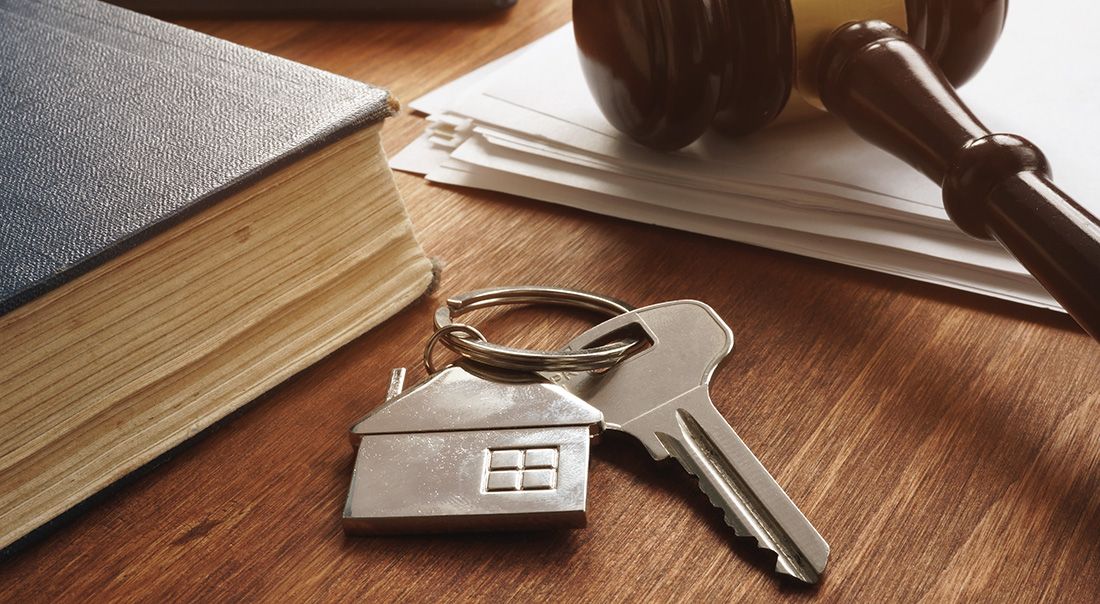 House keys, a gavel, and a law book