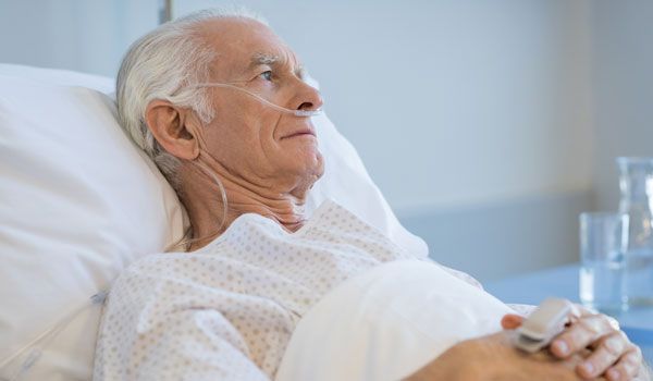 Senior man in a hospital bed