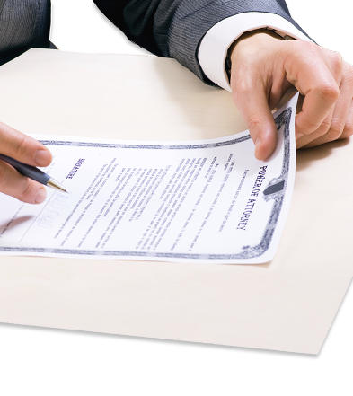 close up of person signing POA document
