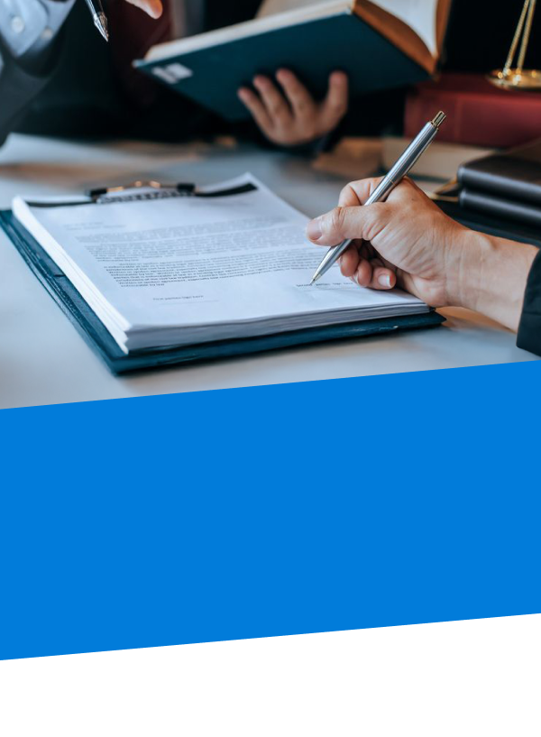 close up of power of attorney documents and a hand holding a pen