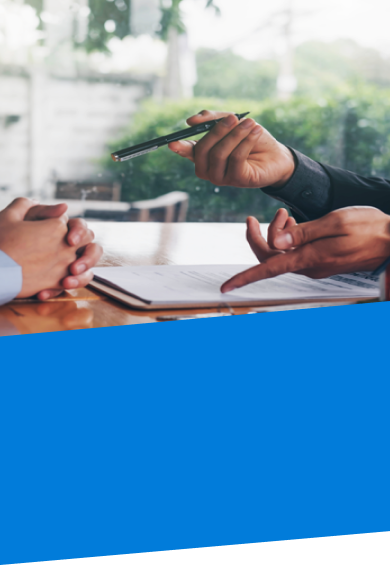 two people sitting at table going over funding a living trust