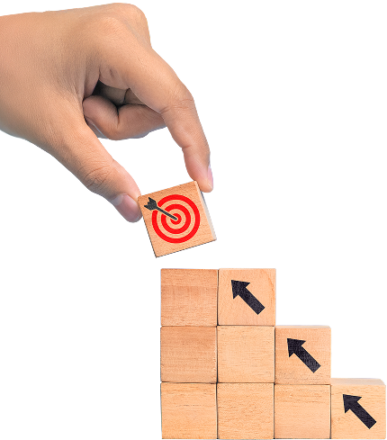 a hand stacking blocks resembling stairs going upward