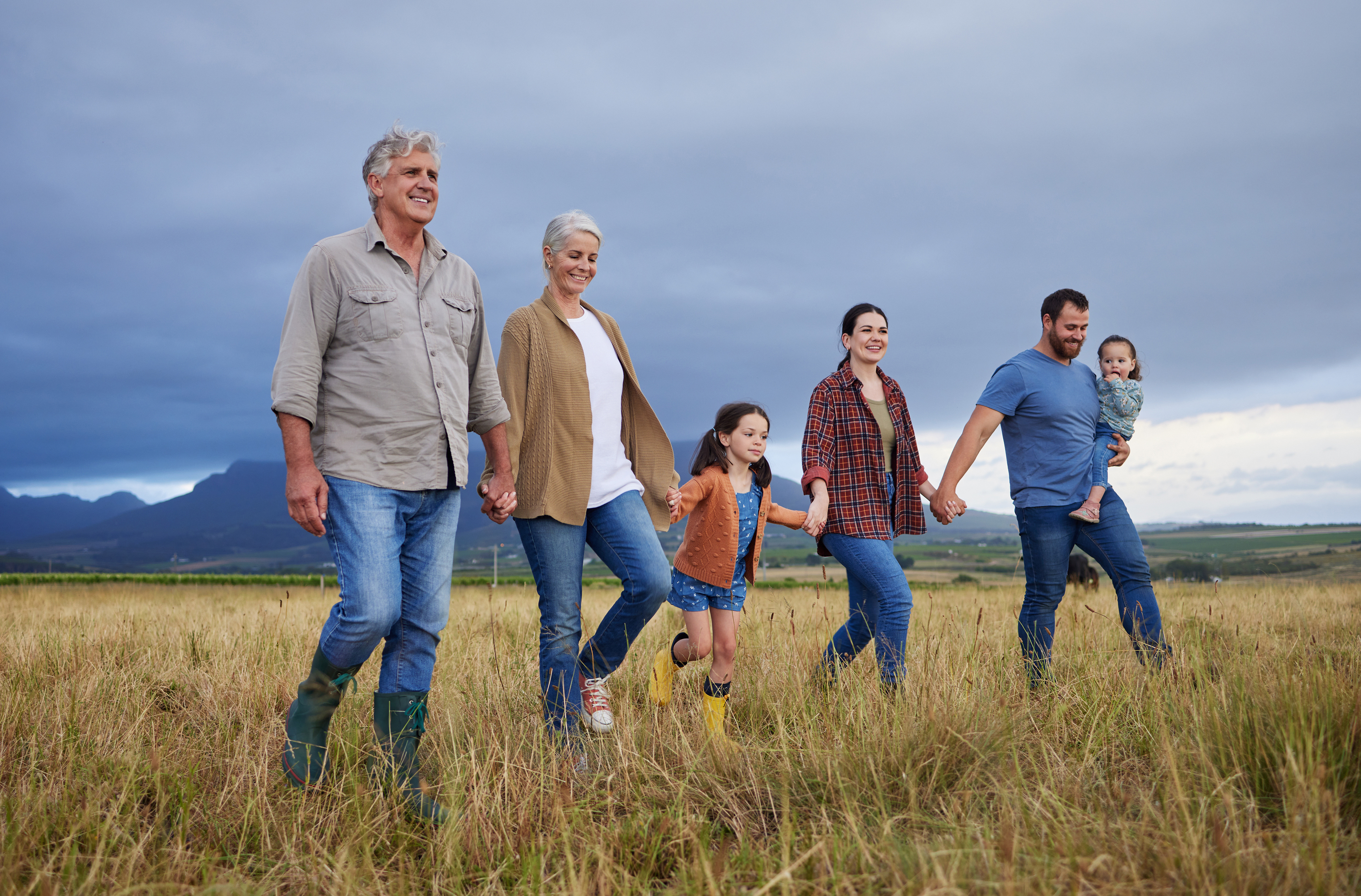 Family walking through field together